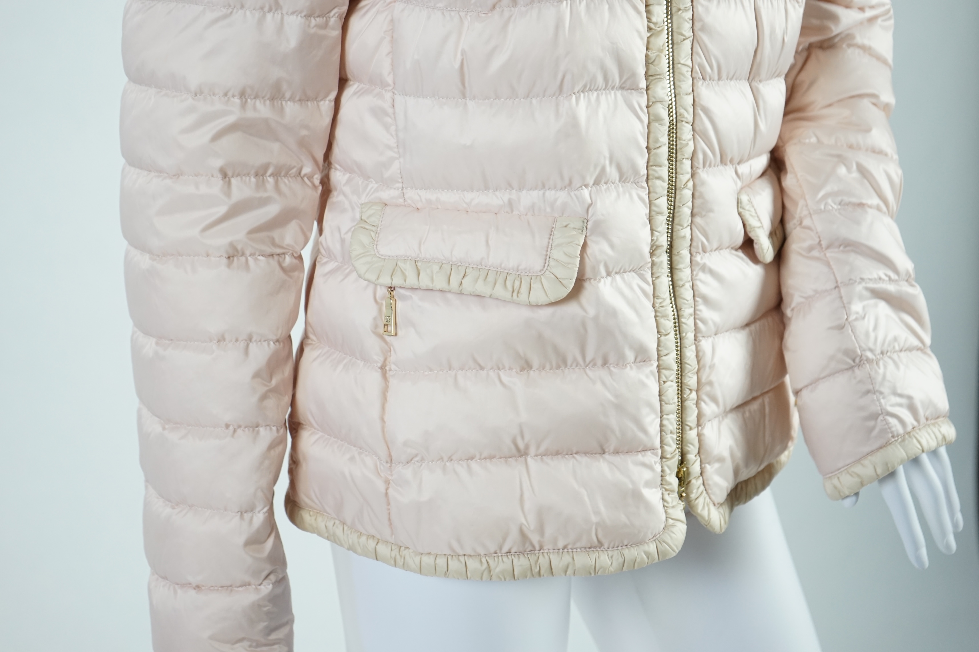 A Basler lady's pink down jacket, another coat with matching cardigan, a long sleeve t-shirt and a metallic silver shirt. Approx sizes 14-16 Proceeds to Happy Paws Puppy Rescue